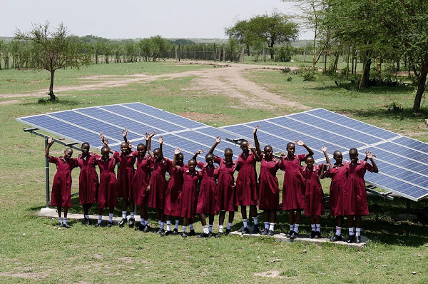 Students in front of solar panels